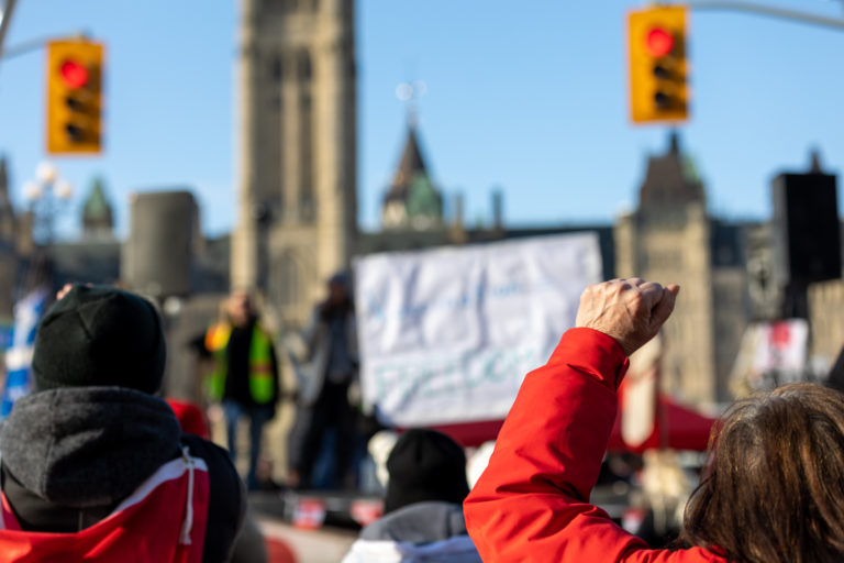 Clenched raised fist at Canadian trucker street protest in Ottaw